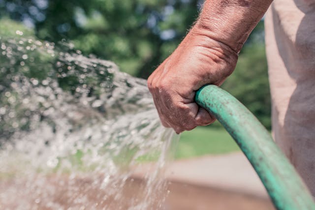 Water being poured for mixing concrete